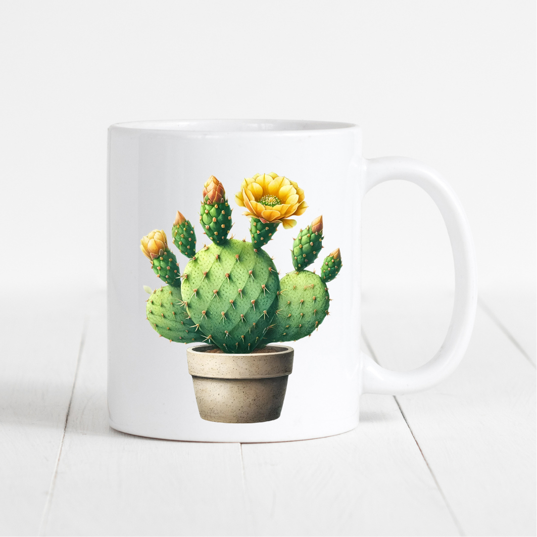 witte mok met cactus afbeelding met gele bloem